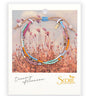 A semi precious stone bracelet on a branded cardstock