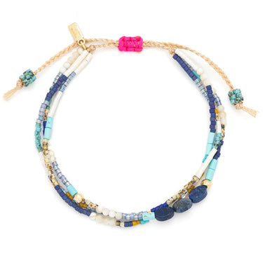 A beaded bracelet on a white background