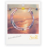 A semi precious stone bracelet on branded cardstock