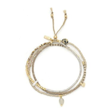 Multistrand beaded necklace with gold accents on a white background