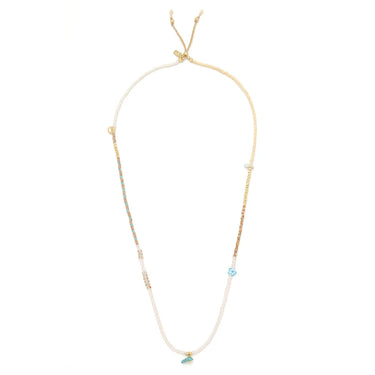 Delicate necklace with small blue beads on a white background