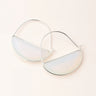Large hoop earrings with reflective prism on a light background