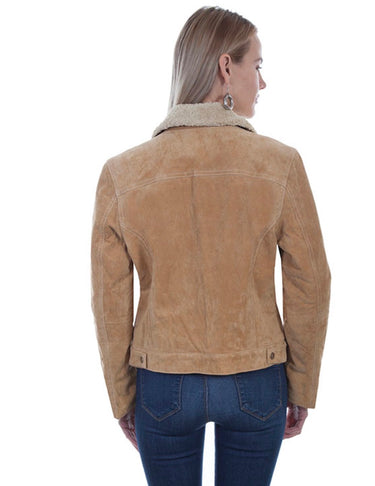 A woman viewed from the back wearing a tan suede jacket with a light beige sherpa collar and dark blue jeans, set against a plain white background.