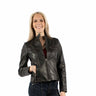 a woman wearing a black leather jacket with a vintage feel and zipper detailing with blue jeans on a white background