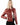 A woman wearing a soft red leather jacket and black pants on a white background