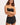 A woman wearing a bikini top and black shorts
