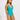 Woman wearing a teal swimsuit against a white background