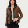 a woman wearing a mixed media jacket, which consists of a denim jacket and brown checkered blazer on a white background.