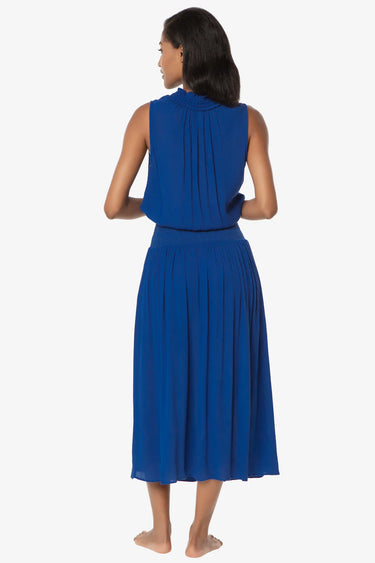 Woman wearing a blue dress on a white background