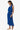 Woman wearing a blue dress on a white background