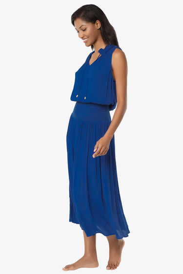 Woman wearing a blue dress on a white background