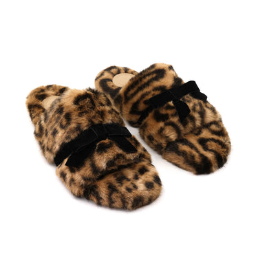 A pair of fuzzy leopard-print slippers with black velvet bow accents, displayed on a clean white background.