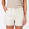 Person wearing beige shorts and a sleeveless top on a white background