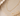 a close up of a CZ bar necklace on a neutral background