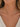a woman wearing a dainty CZ bar necklace with a CZ stone accent