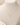 A delicate gold chain necklace with a small cross pendant made of tiny white pearls, displayed on a cream-colored jewelry bust.