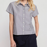 A woman wearing black striped boxed collared shirt and a black mini skirt