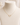A delicate gold chain necklace with an open heart-shaped pendant, displayed on a cream-colored fabric jewelry bust.