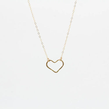 A delicate gold chain necklace featuring an open heart-shaped pendant, displayed against a clean white background.