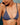 Woman wearing a blue bikini with a clear background