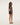 Woman wearing a black dress on a white background