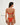 Woman wearing a red orange bikini on a white background with 'BRAZILIAN' text.