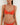 Woman wearing a red orange bikini against a white background