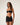 Woman wearing a black strapless bikini top and sheer mesh skirt  on a white background