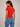 a woman wearing red baby tee