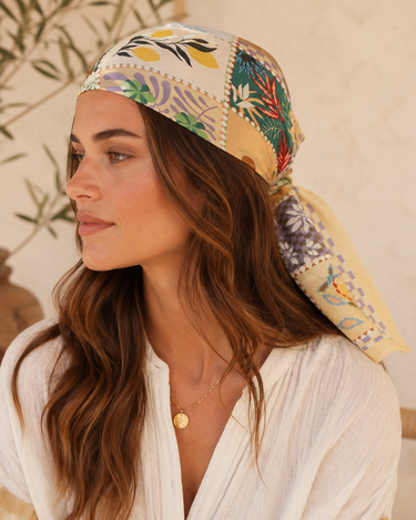 A woman wearing a patchwork scarf 