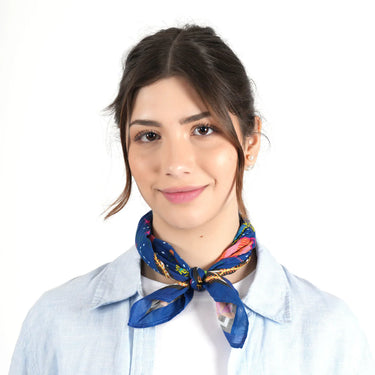 Woman wearing a colorful scarf around her neck on a white background