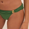 Green bikini bottom with a gold buckle on a beige background