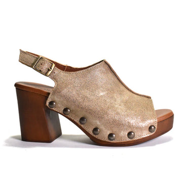 women's open-toe block-heel sandals with metallic champagne-gold textured uppers, bronze-tone metal studs, and brown wooden soles On a white background