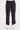 A woman wearing black cargo pants with a cinched detailing on the side of the leg panel.