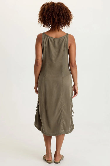 a woman wearing a moss green button up dress