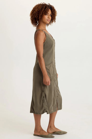 A woman wearing moss button up dress