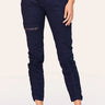 Navy blue jogger pants worn by a person on a white background
