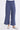 A close up of the blue twill cargo pants on a white background 