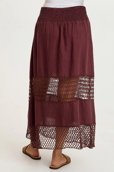Maroon skirt with lace detailing on a white background