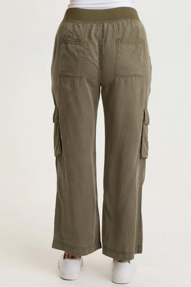 a woman wearing cropped twill pant in moss green