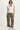 A woman wearing a cropped twill cargo pant in moss green