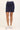 Navy blue skirt worn by a person on a white background