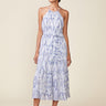 Woman wearing a floral dress on a beige background