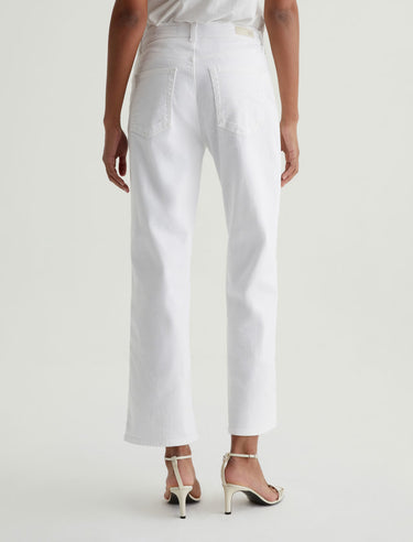 White pants worn by a person on a white background