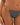 Close-up of a woman wearing a teal crinkle textured bikini bottom with a hammered gold-toned chain detail on the side strap, featuring a high-leg cut against light skin.