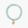 Discover our chic green faceted gemstone bracelet with a lucky gold frog charm. A comfortable stretch fit, perfect for everyday elegance. Shop unique beaded jewelry.