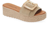 Beige sandal with a buckle on a white background
