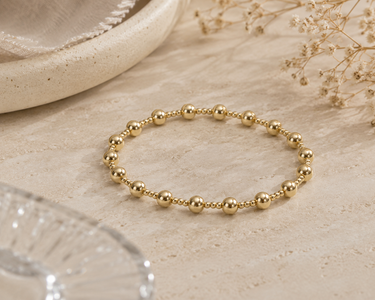 a beaded bracelet on a neutral background 
