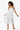 women wearing crochet white maxi skirt/dress on white background
