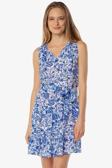 Woman wearing a blue floral dress on a white background